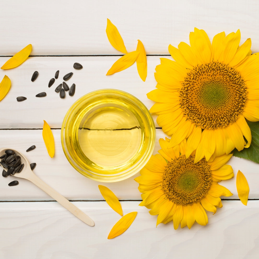 Sunflower seeds with oil and big sunflowers